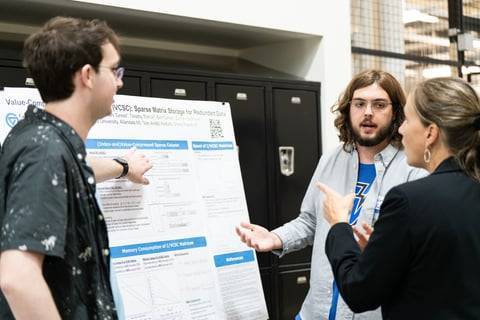A GVSU computing student consults with Aero Med Spectrum Health staff on an iPad app.